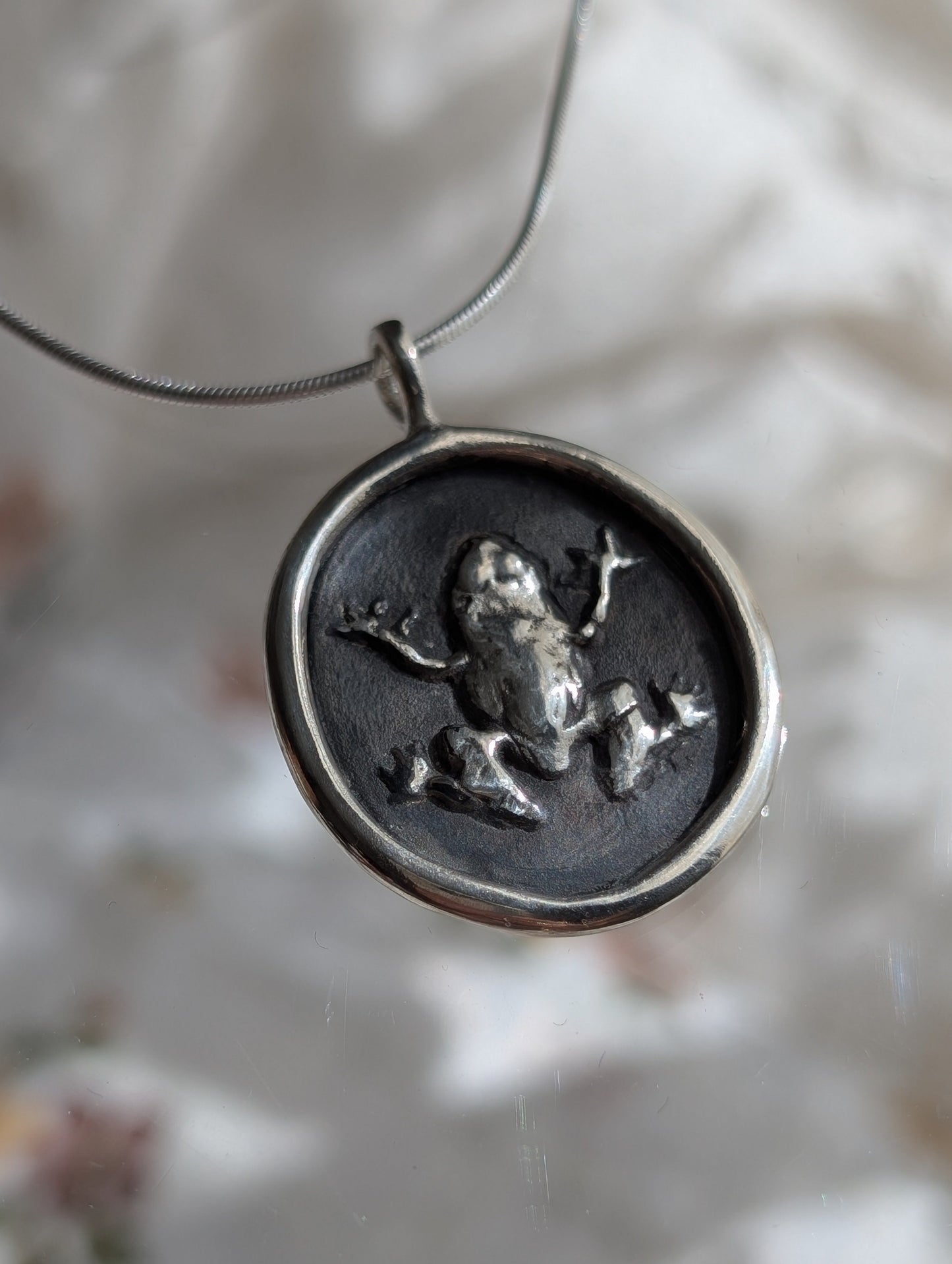 the frog pendant