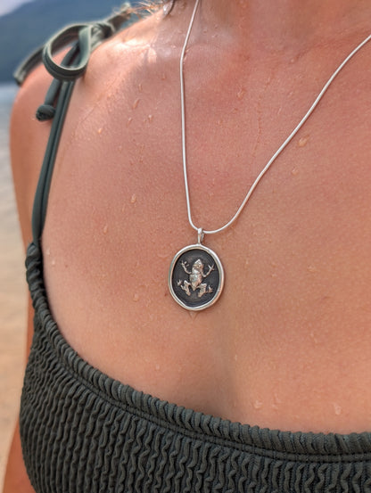 the frog pendant